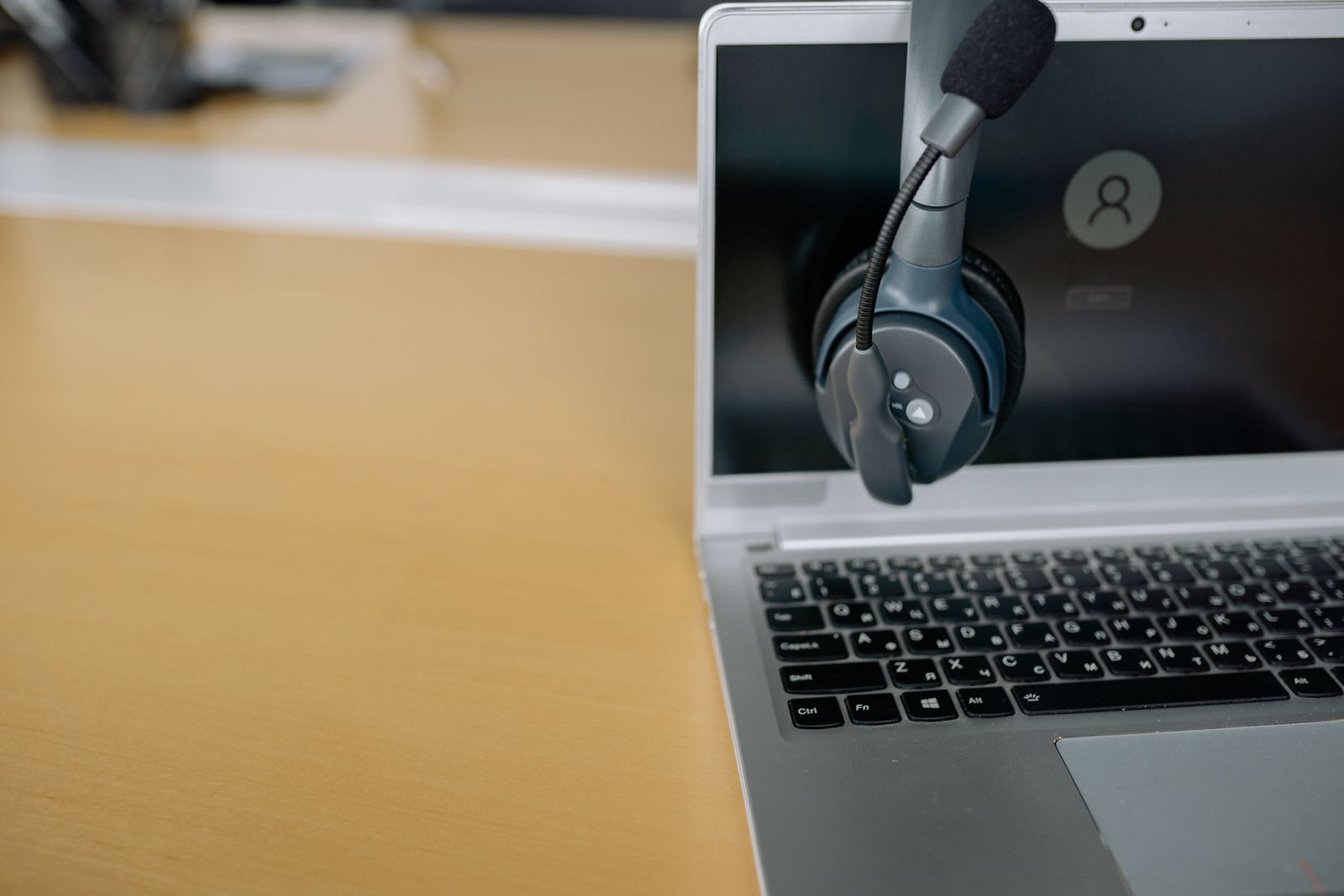 Webinar desk with headset and laptop